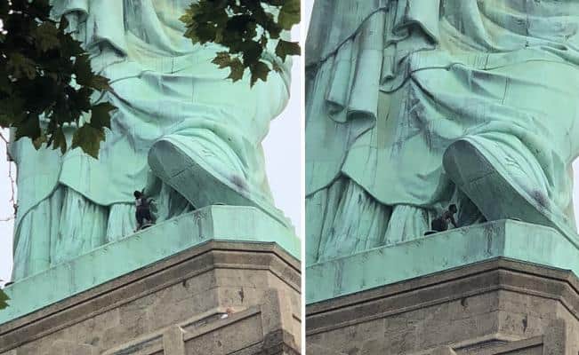 Mujer escala la Estatua de la Libertad en protesta por política de Trump (Video)