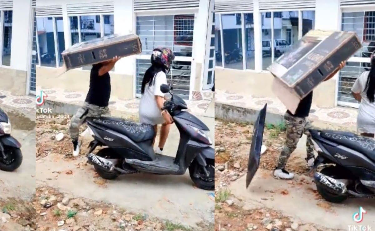 VIDEO: Pareja rompe TV cuando intentaban llevarla en una moto