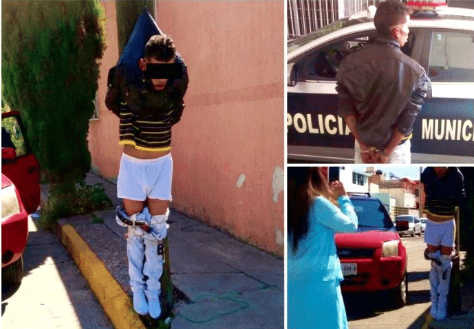 ¿Estará Batman en México?. Detienen a delincuente y lo cuelgan de poste