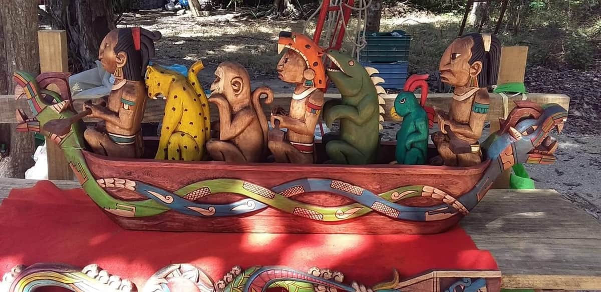 Herencia ancestral: joven maestro maya plasma sabiduría milenaria en madera