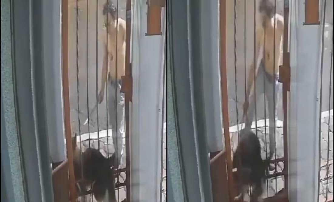 VIDEO: Captan a sujeto golpeando a un perro atorado en una reja en Puebla